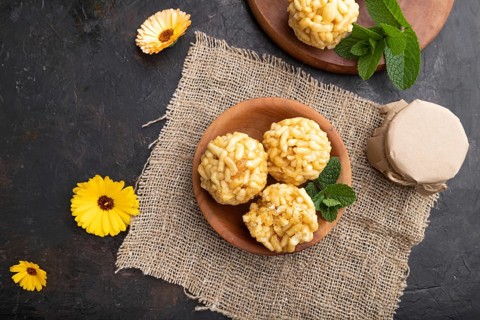 Traditional Tatar candy chak-chak made of dough and honey with cup of coffee on a black concrete
