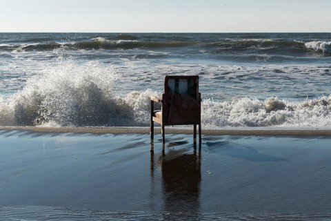 Upholstered chair washed up on the North Sea shore, flotsam, Oksbol, Region Syddanmark, Denmark,