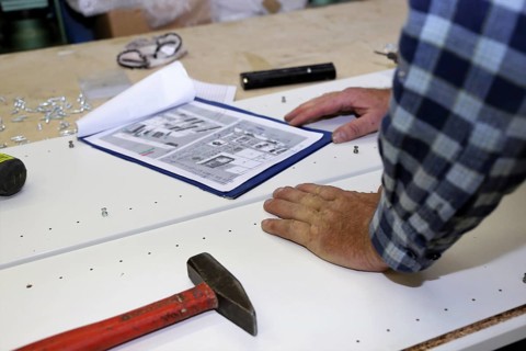 Carpenter at work in his carpentry workshop