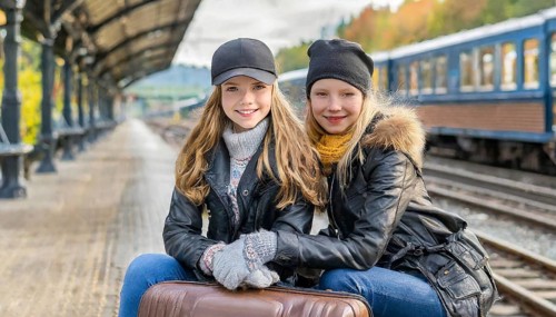 AI generated, Two young blonde woman want to travel and wait in the station for the train, 18,
