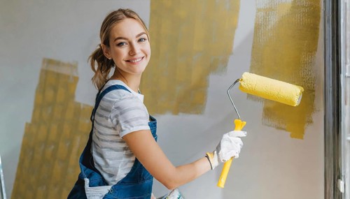 AI generated, woman, woman, a young girl paints a wall with new paint, yellow, yellow, renovation