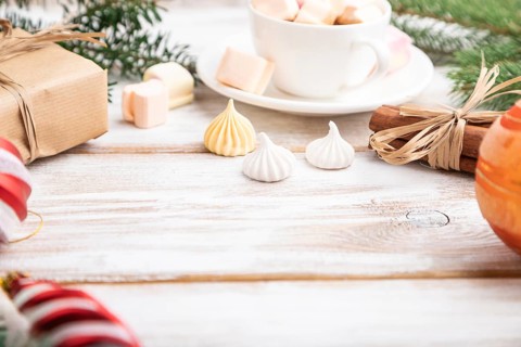 Christmas or New Year composition. Decorations, box, balls, cinnamon, fir and spruce branches, cup