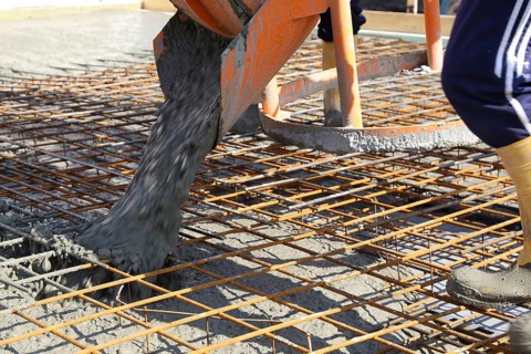 Concreting a floor slab with ready-mixed concrete on the construction site of a residential