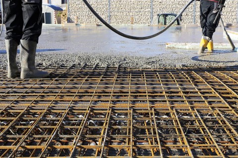 Concreting a floor slab with ready-mixed concrete on the construction site of a residential