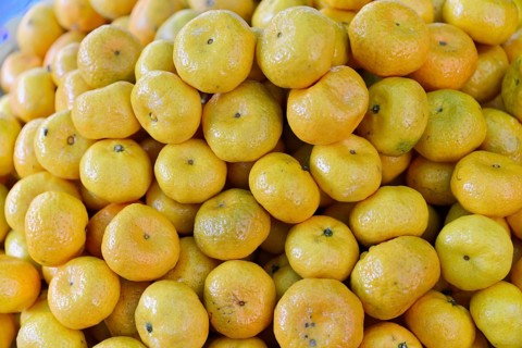 Mandarins at a market in Mandalay, Mandalay, Myanmar, Asia