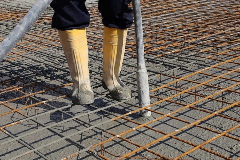 Concreting a floor slab with ready-mixed concrete on the construction site of a residential