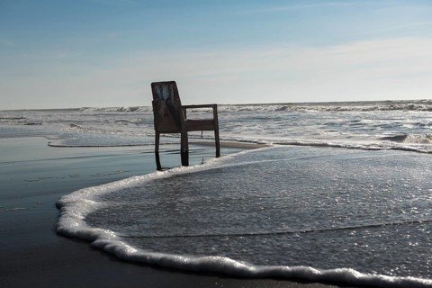 Upholstered chair washed up on the North Sea shore, flotsam, Oksbol, Region Syddanmark, Denmark,