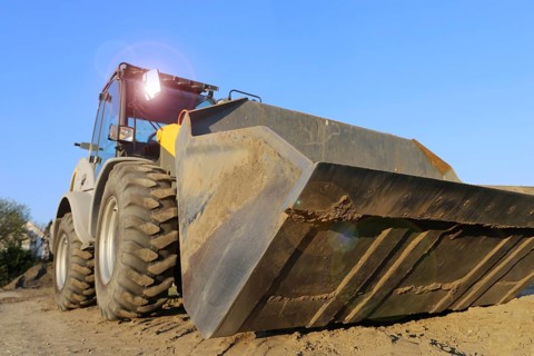 Wheel loader at sunset, here in the Ringstrasse development area (Mutterstadt,
