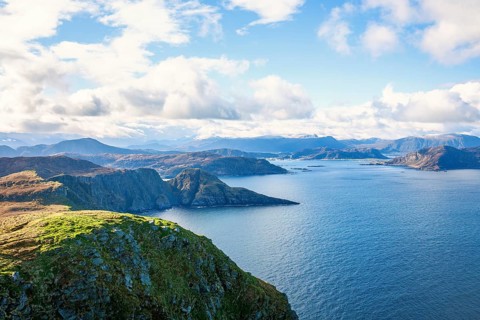 View of a fjord landscape with a rocky coast on the Norwegian coast, Runde, Heroy, Norway, Europe