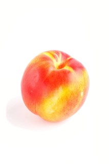 Nectarine isolated on white background. Side view, close up