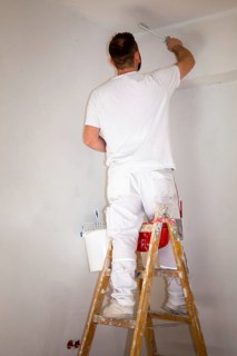 Painter renovates an old flat