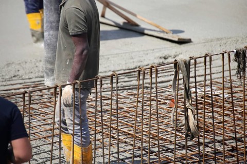 Concreting a floor slab with ready-mixed concrete on the construction site of a residential