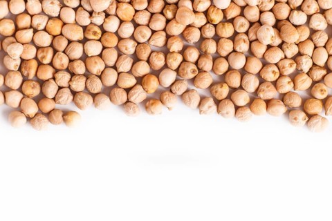 Texture of chickpeas isolated on white background. Top view