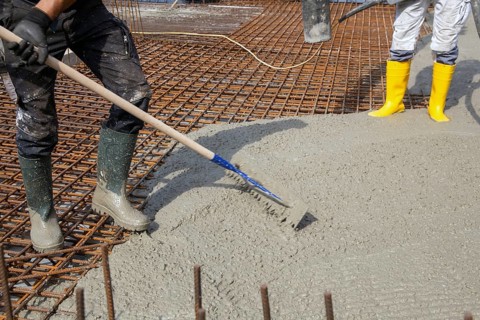 Delivery of ready-mixed concrete to the construction site of a residential building in a new