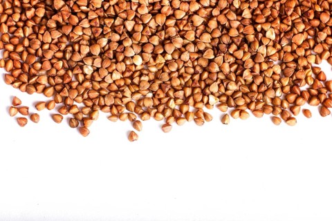 Texture of buckwheat isolated on white background. Top view