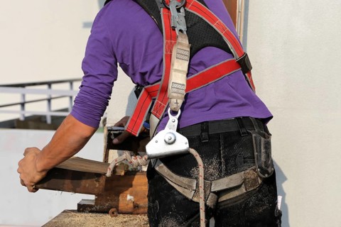 Roofer with fall protection
