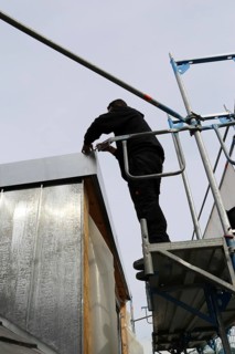 Roofer working on a new dormer window (model relased)