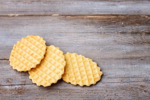 Sweet waffle on a rustic wooden background with copy space