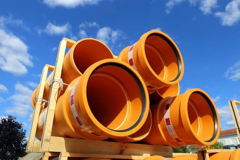 Stack of KG pipes on a construction site in the Mutterstadt development area, Rhineland-Palatinate