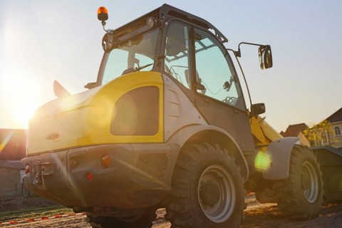 Wheel loader at sunset, here in the Ringstrasse development area (Mutterstadt,