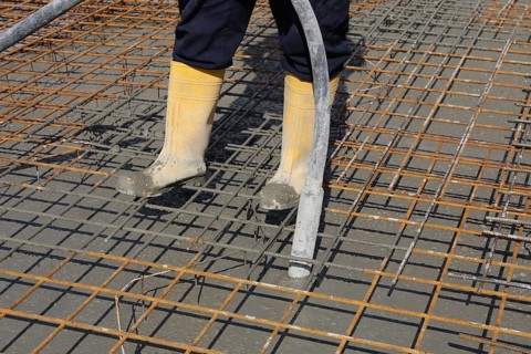Concreting a floor slab with ready-mixed concrete on the construction site of a residential