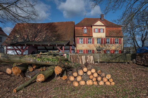Historic vicarage from 1734 of St Egidien Church, in front the trunk of a beech (Fagus), Beerbach,