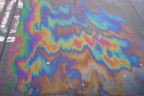 Leaking petrol on the concrete floor at a petrol station, Bavaria, Germany, Europe
