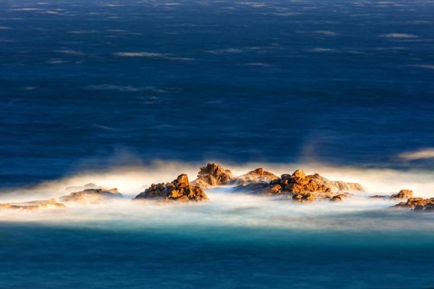 The sea washes around an offshore reef, long exposure, La Crucecita, Baja de Huatulco, South