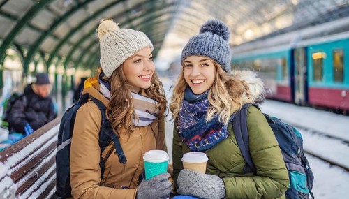 AI generated, Two young blonde woman want to travel and wait in the station for the train, 20, 25,