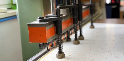 Automatic drilling machine or hole line drilling machine as used in a cabinet maker's workshop