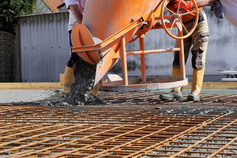 Concreting a floor slab with ready-mixed concrete on the construction site of a residential