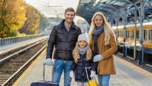 AI generated, A young family wants to travel and waits in the station for the train, 30, 35, years,