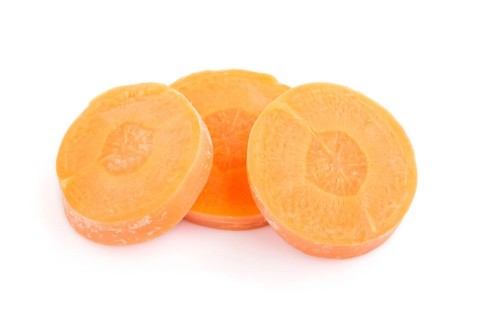 Carrot slices isolated on white background. top view, flat lay, close up, macro