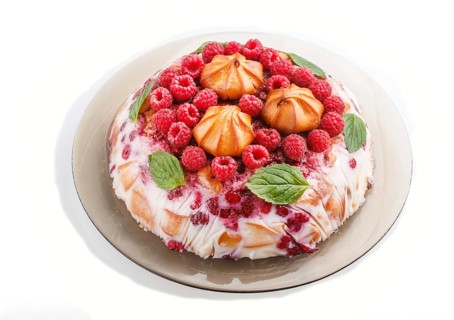 Homemade jelly cake with milk, cookies and raspberry isolated on white background. side view. close