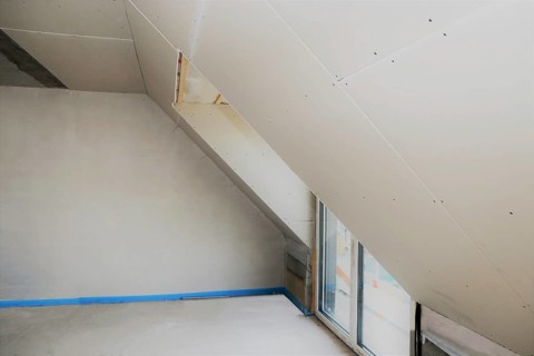Attic conversion, loft conversion. You can see the pitched roof with door and skylight panelled