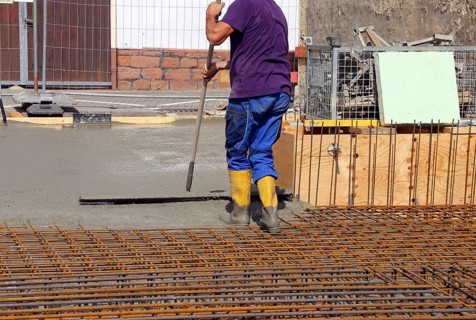 Concreting a floor slab with ready-mixed concrete on the construction site of a residential