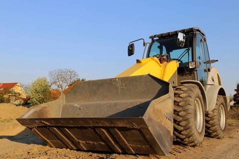 Wheel loader at sunset, here in the Ringstrasse development area (Mutterstadt,