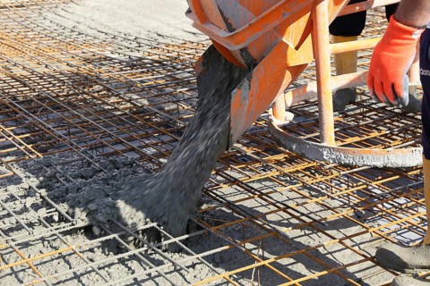 Concreting a floor slab with ready-mixed concrete on the construction site of a residential