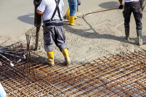 Delivery of ready-mixed concrete to the construction site of a residential building in a new