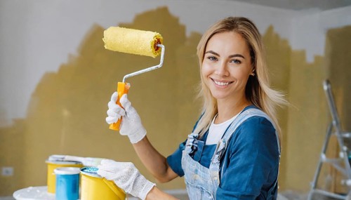 AI generated, woman, woman, a young girl paints a wall with new paint, yellow, yellow, renovation