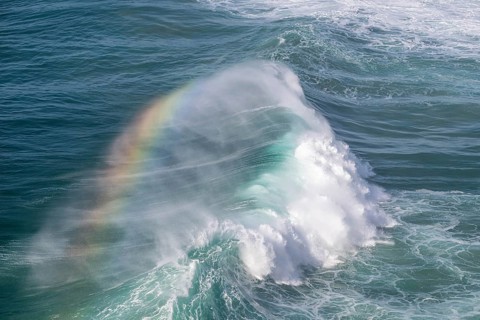Spectral colours in the spray of a crashing wave, Nazare, Portugal, Europe