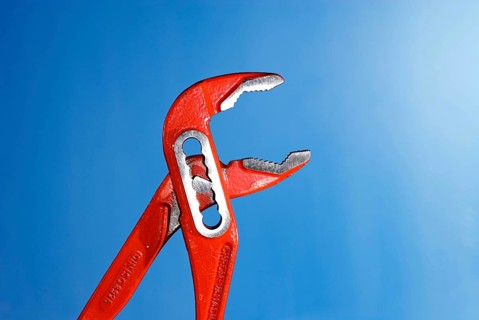 Open, opened red Tongue-and-groove pliers