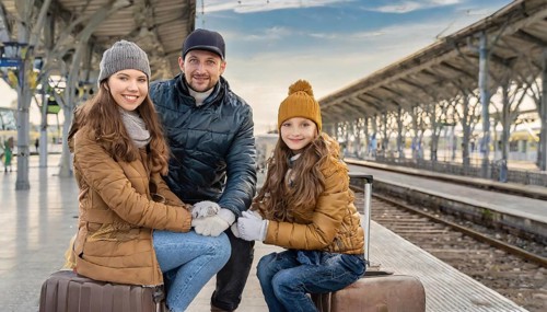 AI generated, A young family wants to travel and waits in the station for the train, 30, 35, years,