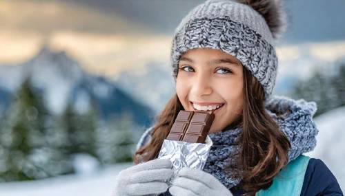KI generated, Young girl, 15, years, eating a bar of chocolate, one person, outdoor shot, ice,