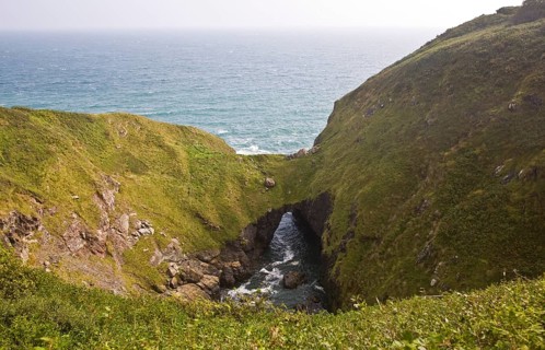 The Devil's Frying Pan coastal feature formed by the collapse and erosion of a large sea cave near