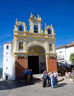 Men gather by the baroque church of San Juan at Zahara de la Sierra, Spain Sunday 13 October 2013
