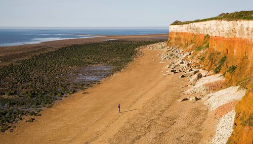 Chalk, red chalk and carstone form striped cliffs of white, red and orange at Hunstanton, Norfolk,