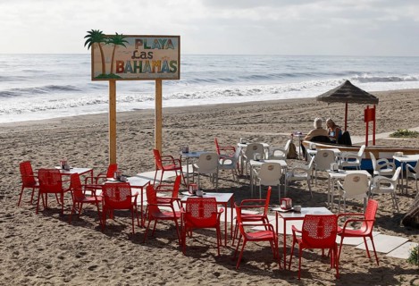 Two woman sitting on the beach in Torremolinos, in a restaurant, 13/02/2019