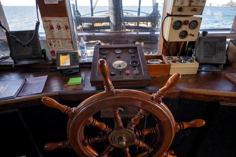 Interior view steering wheel, helm, bridge, bridge, tourist ship, excursion boat, pirate ship