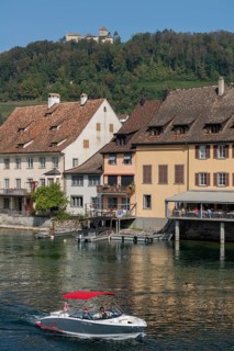Stein am Rhein, Hohenklingen Castle, mountain, restaurant on the water, sports boat, blue sky,